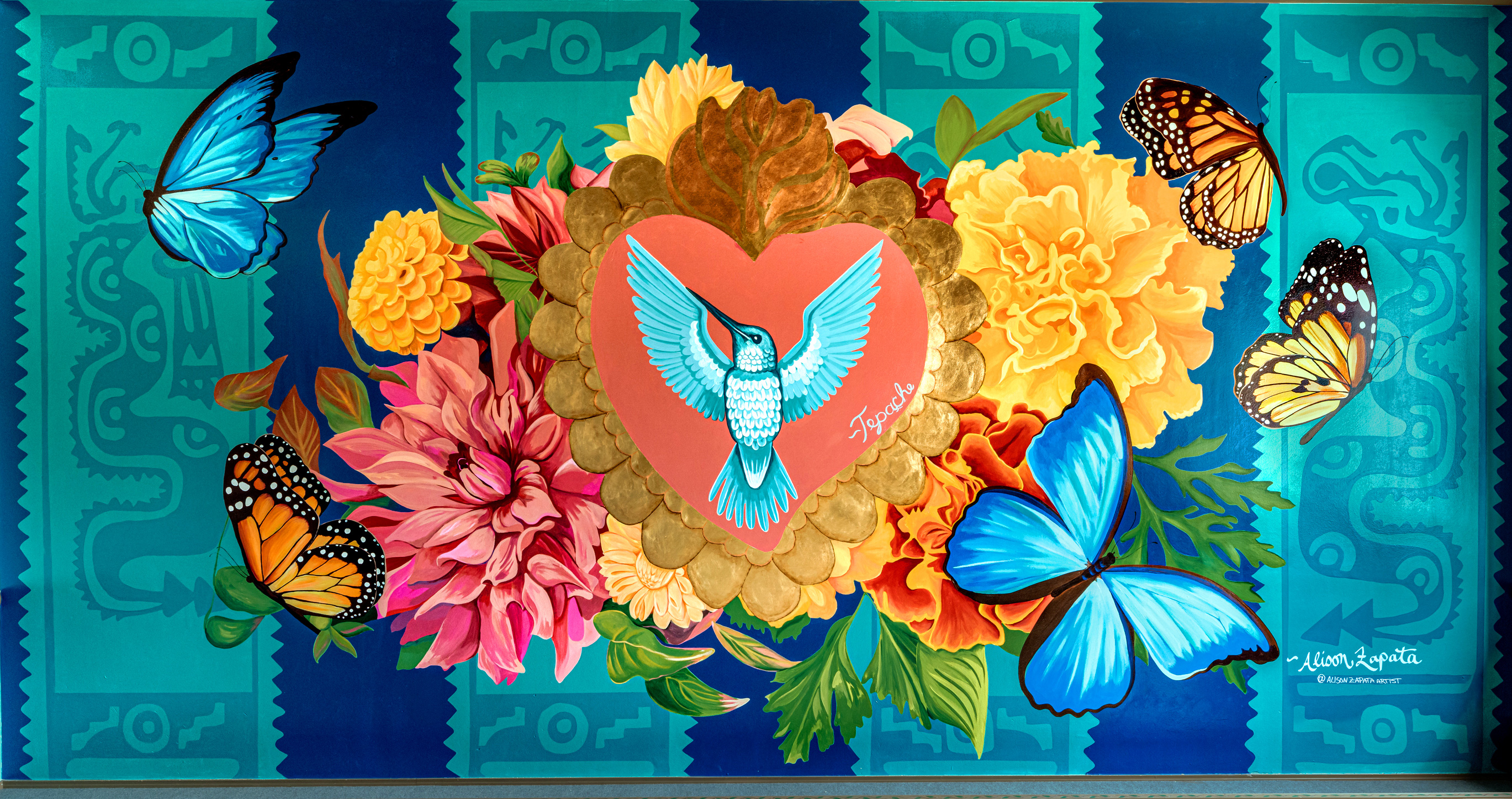 painting of a hummingbird in front of a heart with many shades of blues throughout